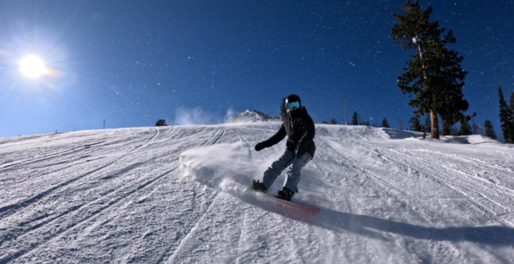 Shannon Dunn-Downing snowboarding down a mountain.