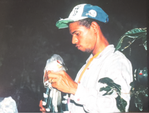 A person holding a bird