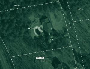 A aerial photograph with a grid over it of a house and lot