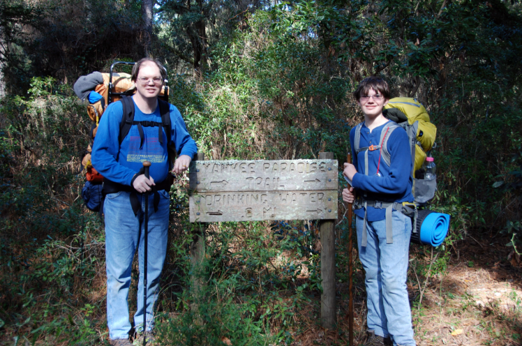 Father and son hiking in the wilderness