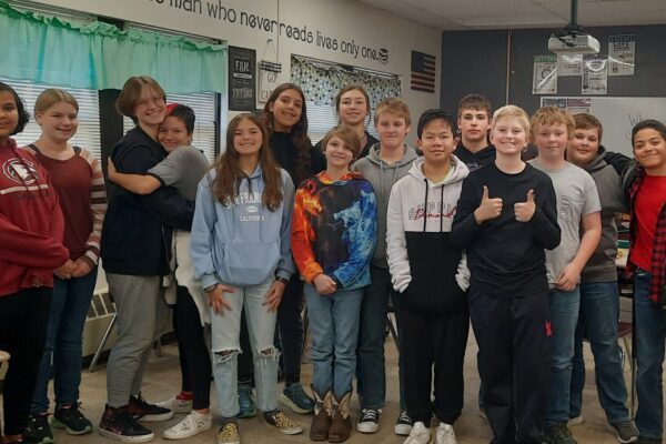Mrs. Waugh's 7th and 8th grade class standing in a classroom at Chadron Middle School.