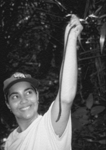Grizelle Gonzalez holds an earthworm that is as long as her arm.