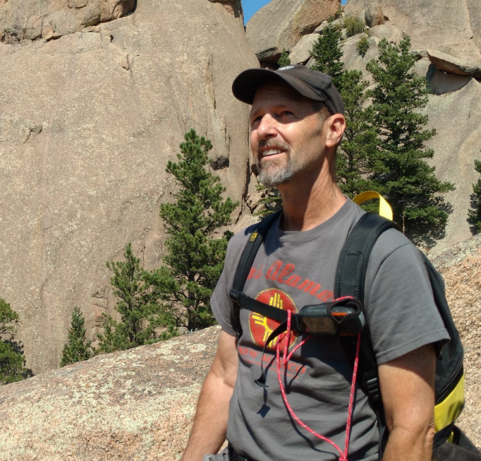 Joe Gurrieri hikes in rocky landscape.