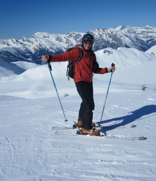 Paul Schaberg stands on skis on a snowy mountain.