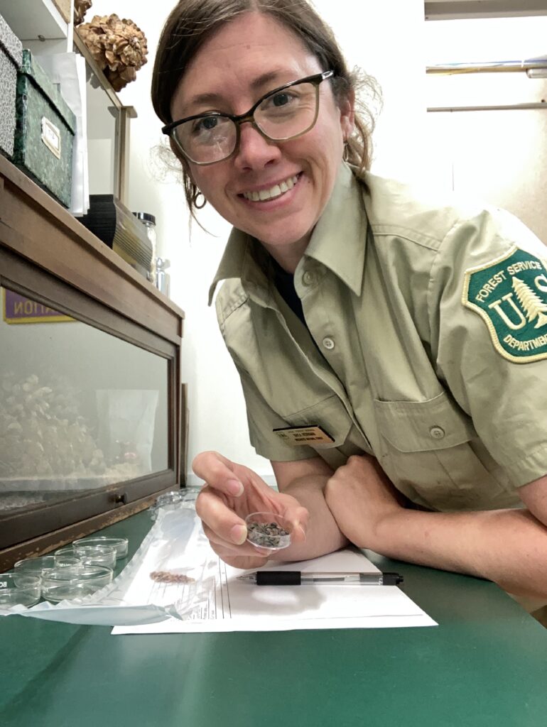 Kayla Herriman working with seeds