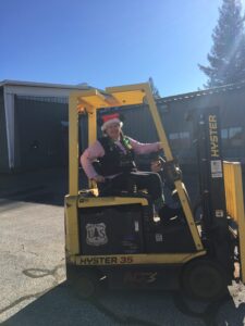 Sara Wilson operating a forklift