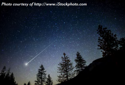 A shooting star in a mountainscape