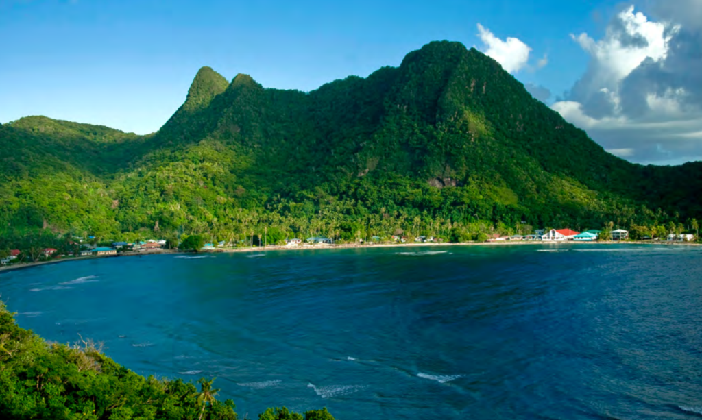A mountainous island covered with green trees