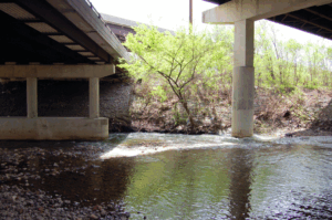 Concrete pillars holding a bridge over a waterway
