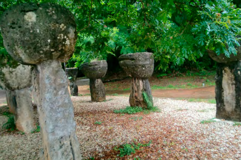A photo of two-piece stone pillars arranged in a rectangle on the ground.