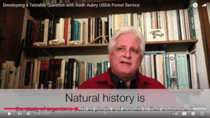 Thumbnail from the Developing a Testable Question with Keith Aubry YouTube video featuring Keith Aubry in front of a bookshelf