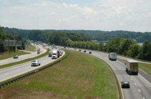 A highway of trucks and cars