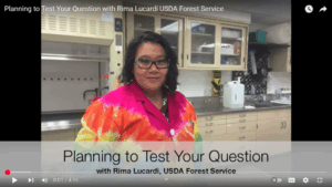 Thumbnail from a YouTube video featuring Rima in a lab in a tie dye lab coat