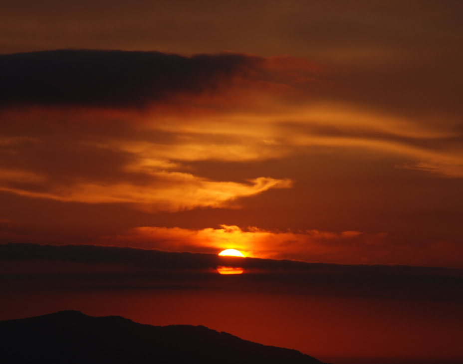 Sun setting over a body of water