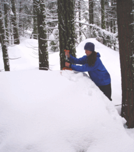 A scientist pumping snowmelt into a sampler
