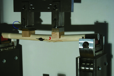 A dowel cracking under pressure from a test
