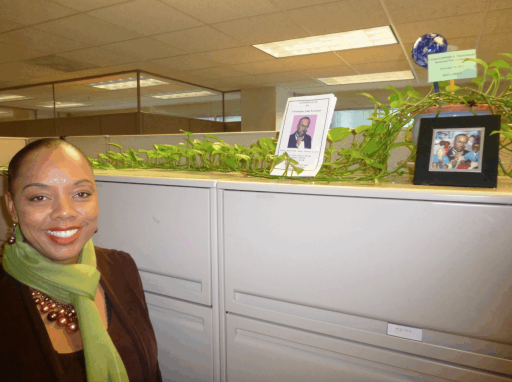 Dr. Sharon Parker standing in font of an indoor memorial garden.