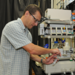 Dr. St. John works in a lab