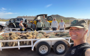 Rebecca Veerman and her coworkers by a trailer after picking up cactus