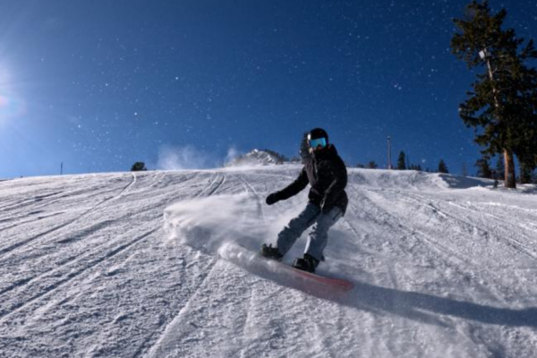 Shannon Dunn-Downing snowboarding down a mountain.