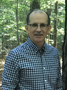 David standing in a forest
