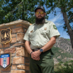 A portrait of Brandon Everett outside