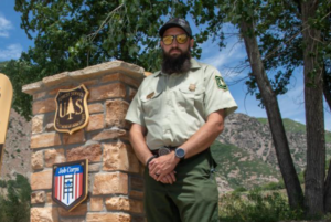 A portrait of Brandon Everett outside