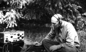 Forsling observing the forest with aninstrument
