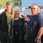 Debbie Bear standing with two coworkers