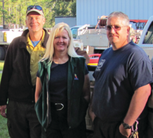Debbie Bear standing with two coworkers