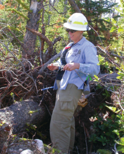 Dr. Sutherland in a forest