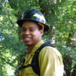 Dexter Strother in protective gear in the forest