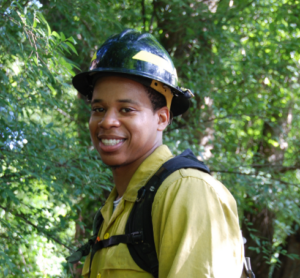 Dexter Strother in protective gear in the forest