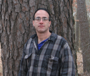 Portrait of Don Bragg in front of a tree