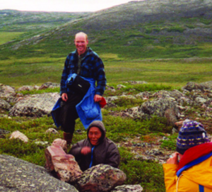 Dr. Gould (in back) looks on as Inuit elder Lena Kamoayok demonstrates how to use a hunting blind to the students in Dr. Gould’s Arctic Field Ecology class.