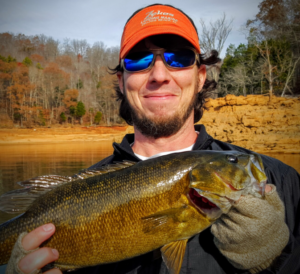 Dr. Oswalt holds up a fish.