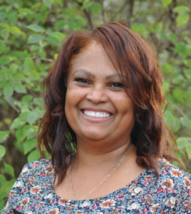 An outdoor headshot of Ms. McGee