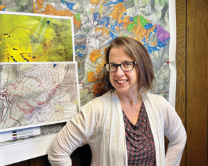 Jennifer Frazier in front of a map