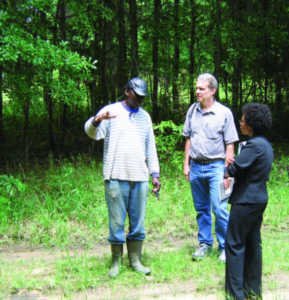 John Schelhas and coworkers discussing a problem in the forest