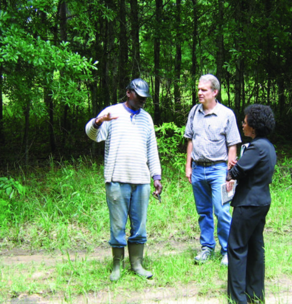 John Schelhas and coworkers discussing a problem in the forest