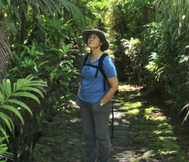 Kathleen Friday hiking through a tropical forest