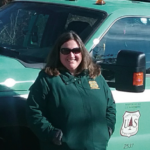 Kristin Floress in front of a work truck
