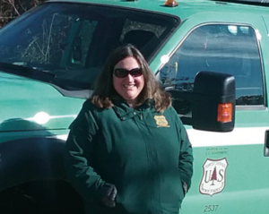 Kristin Floress in front of a work truck