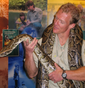 Mr. Bentrup holds a large snake