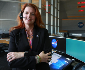 Charlie Blackwell-Thompson standing in front of her console at the Kennedy Space Center's Launch Control Center.