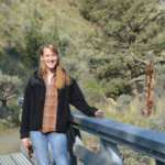 Louise Loudermilk standing on a bridge outside