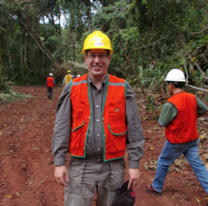 Mike Dockry in protective gear in the forest