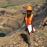 Ms. Johnson stands outside a mine