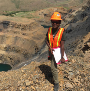 Ms. Johnson stands outside a mine