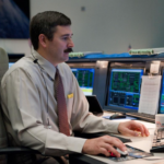 Mike Sarafin at his desk at the Mission Control Center at NASA's Johnson Space Center.